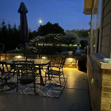 Outdoor landscape spotlight among garden rocks